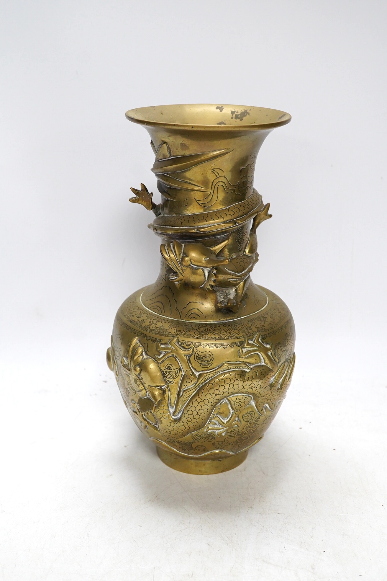 An early 20th century Chinese bronze 'dragon' vase, 25cm. Condition - fair to good